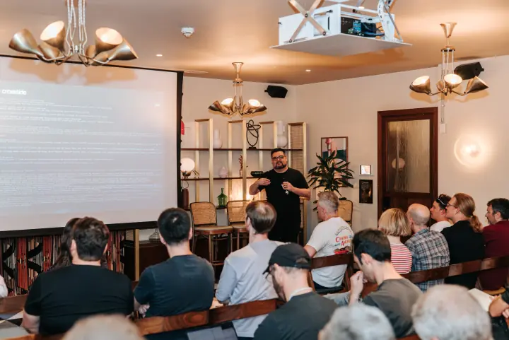 A speaker addressing attendees at the first loveAI gathering